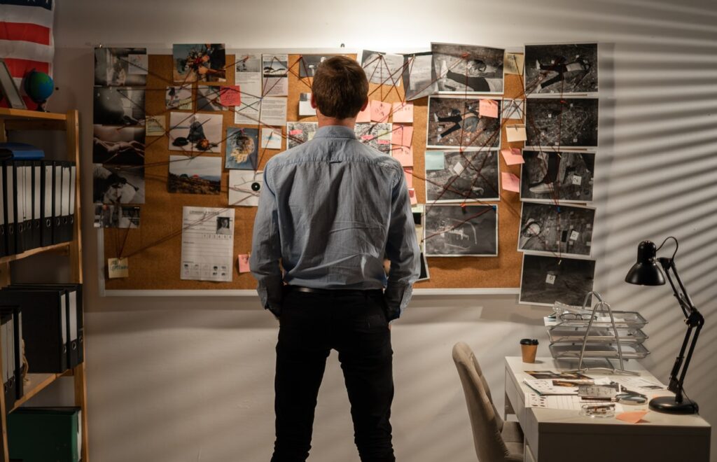 private investigator examining notes